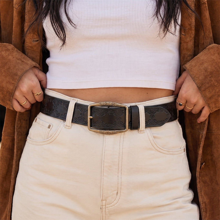 Woman wearing the Drayton Belt in black with cream jeans and a suede jacket