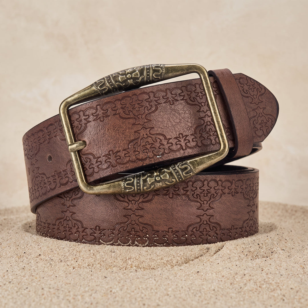 The Drayton Belt in coffee brown coiled on sand