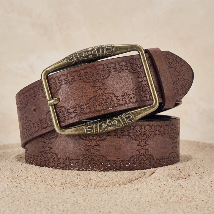 The Drayton Belt in coffee brown coiled on sand