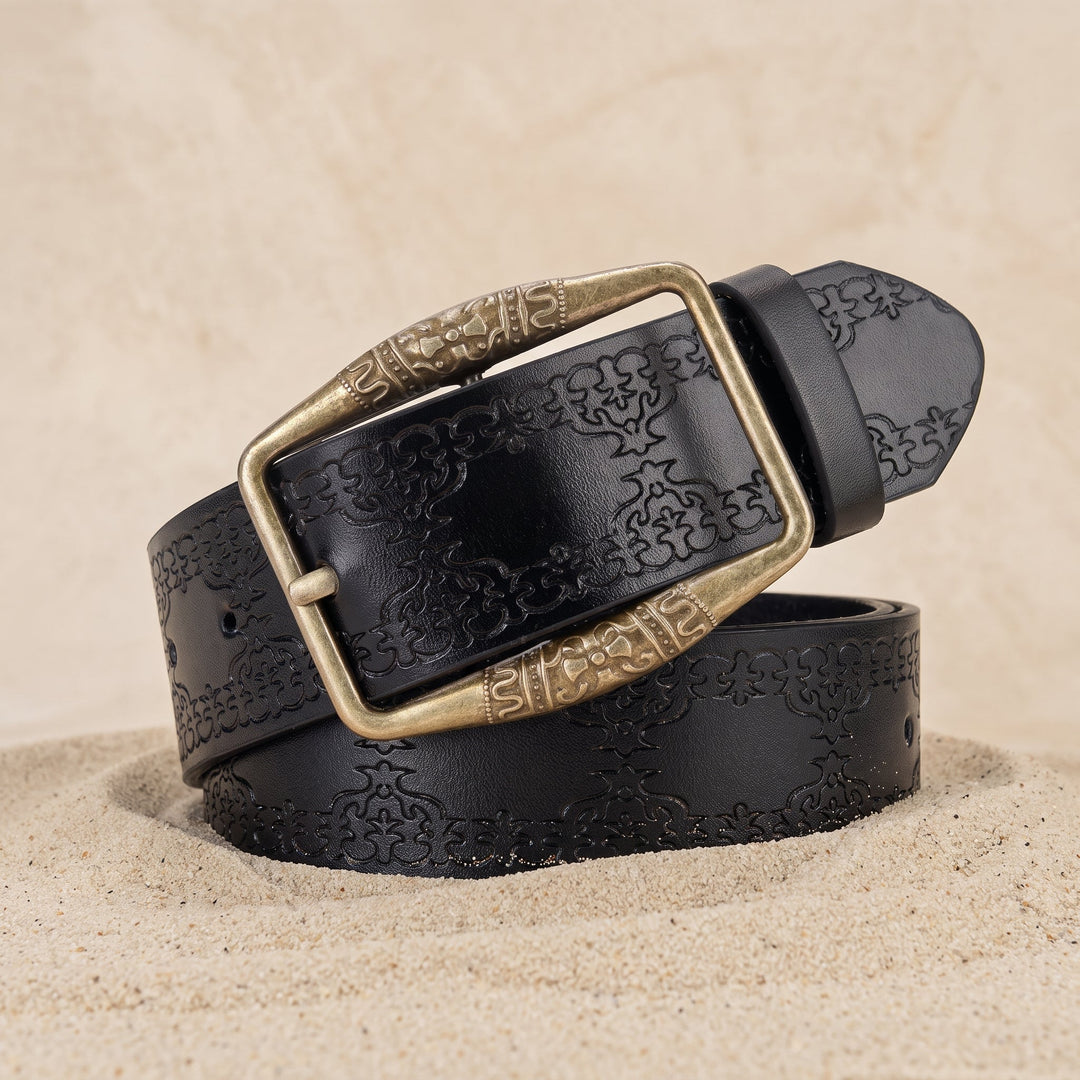 The Drayton Belt in black coiled on sand