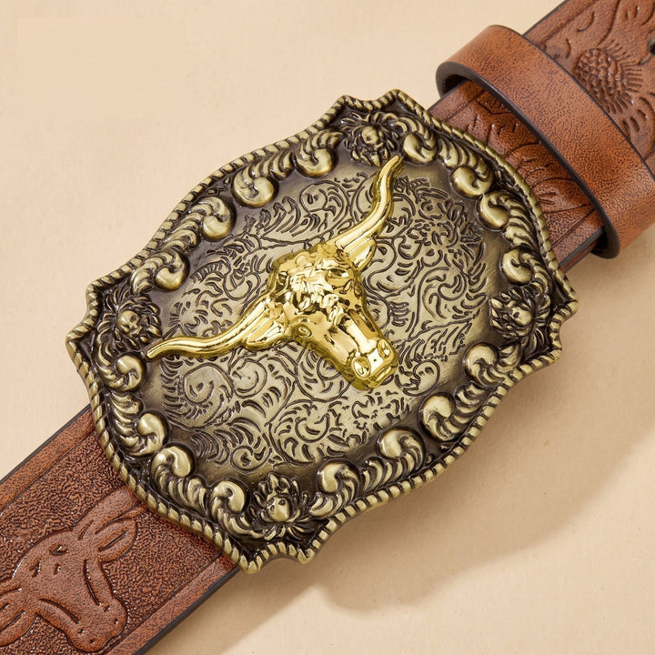 Close-up of the antique brass longhorn buckle and tooled strap on the Dutton Belt