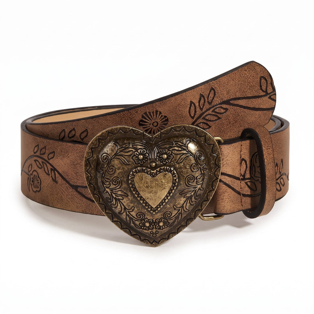 The Esdra Belt with antique brass heart buckle on saddle brown leather