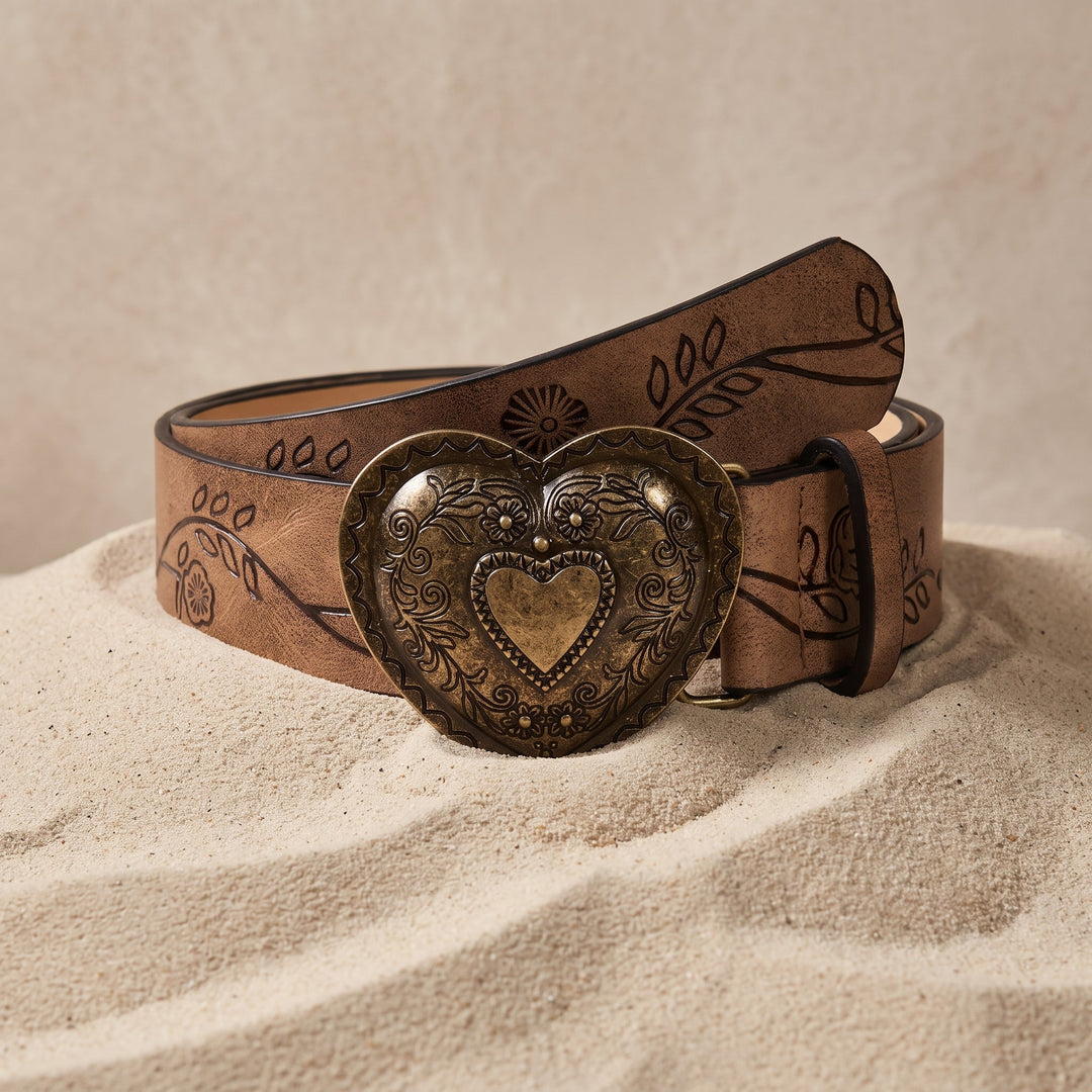 The Esdra Belt in saddle brown coiled on sand