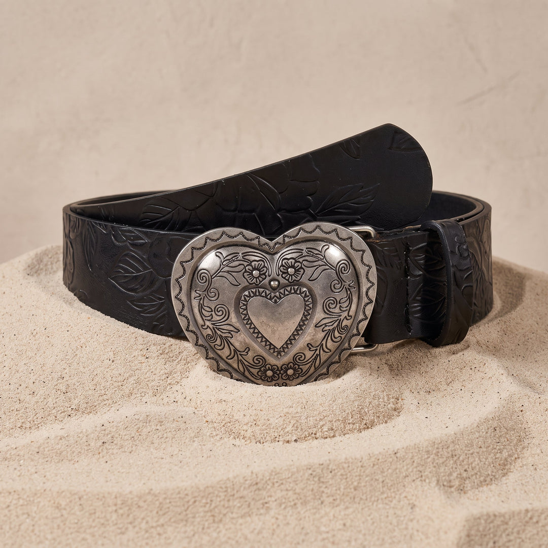 The Esdra Belt in midnight black coiled on sand