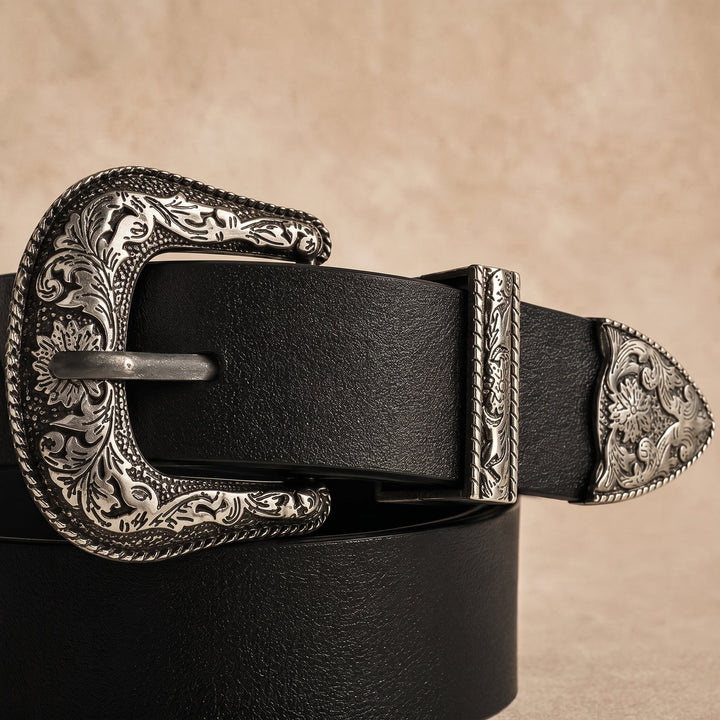 Close-up of the engraved silver-tone buckle, keeper and tip of the Merle Belt