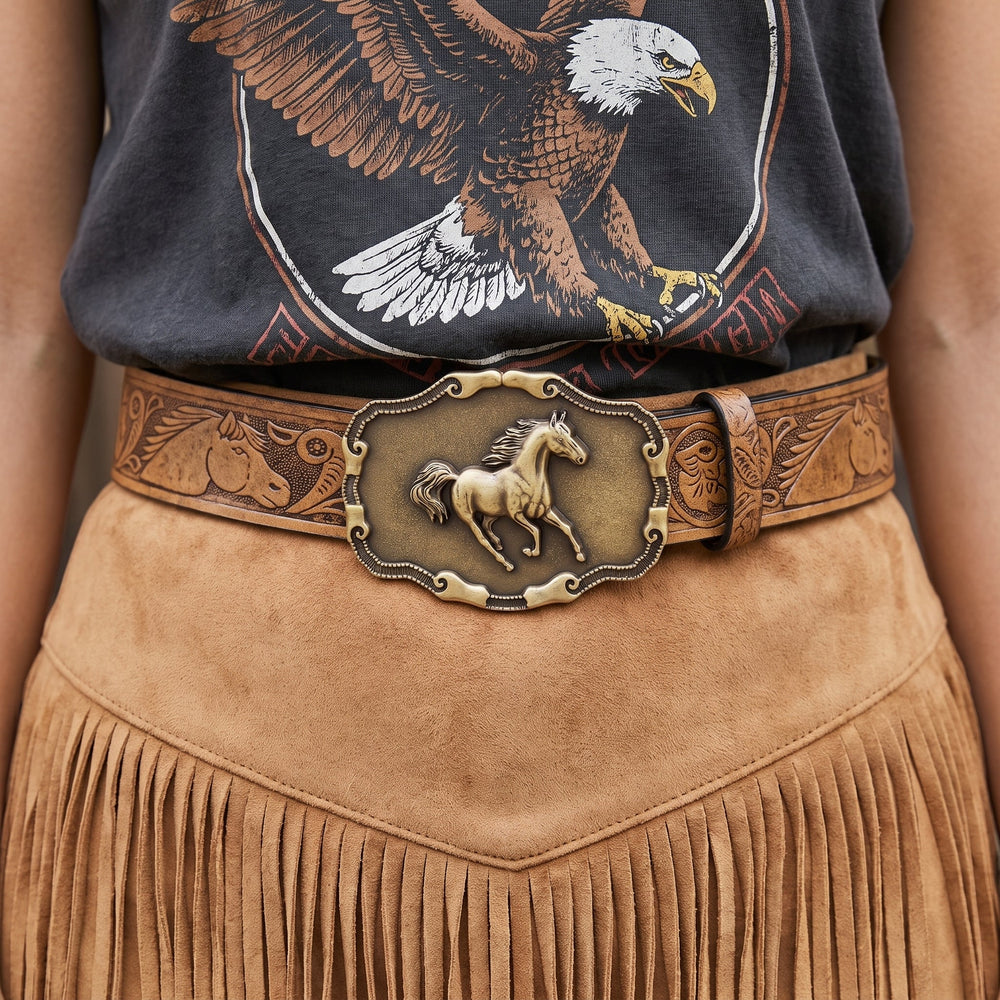 Woman wearing the Vallera Belt with a fringe suede skirt and a graphic tee