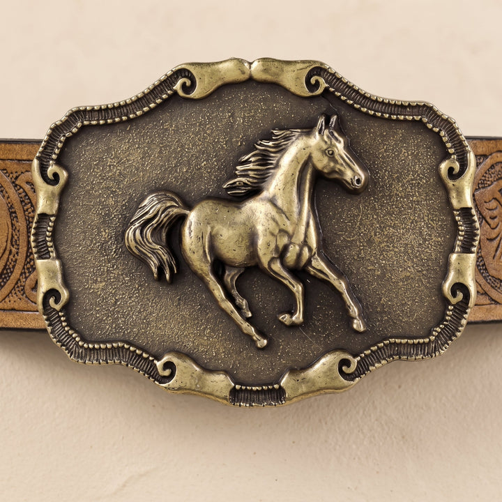 Scalloped scrollwork frame around the Vallera Belt buckle