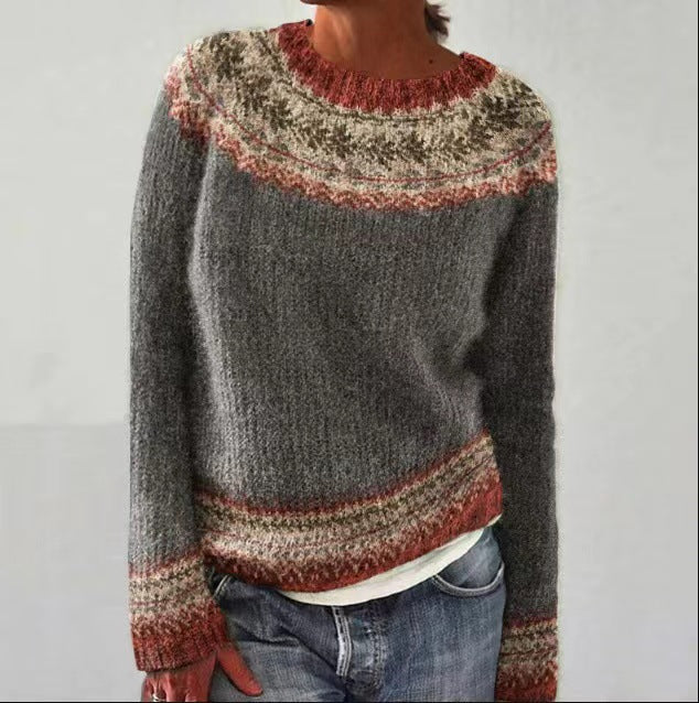 The Calder Sweater — charcoal grey knit with brick-red patterned yoke and hem