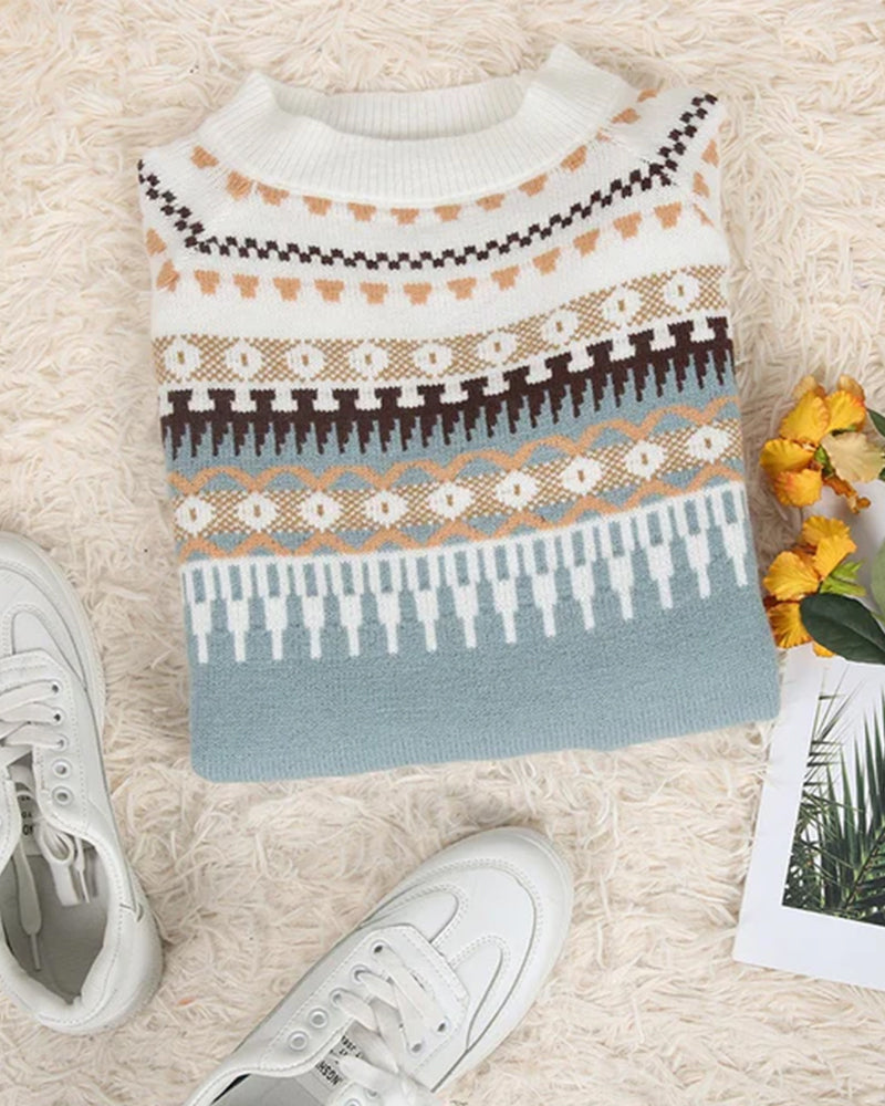 The Yuma Sweater in Blue — folded flat lay showing the yoke pattern and mock neck
